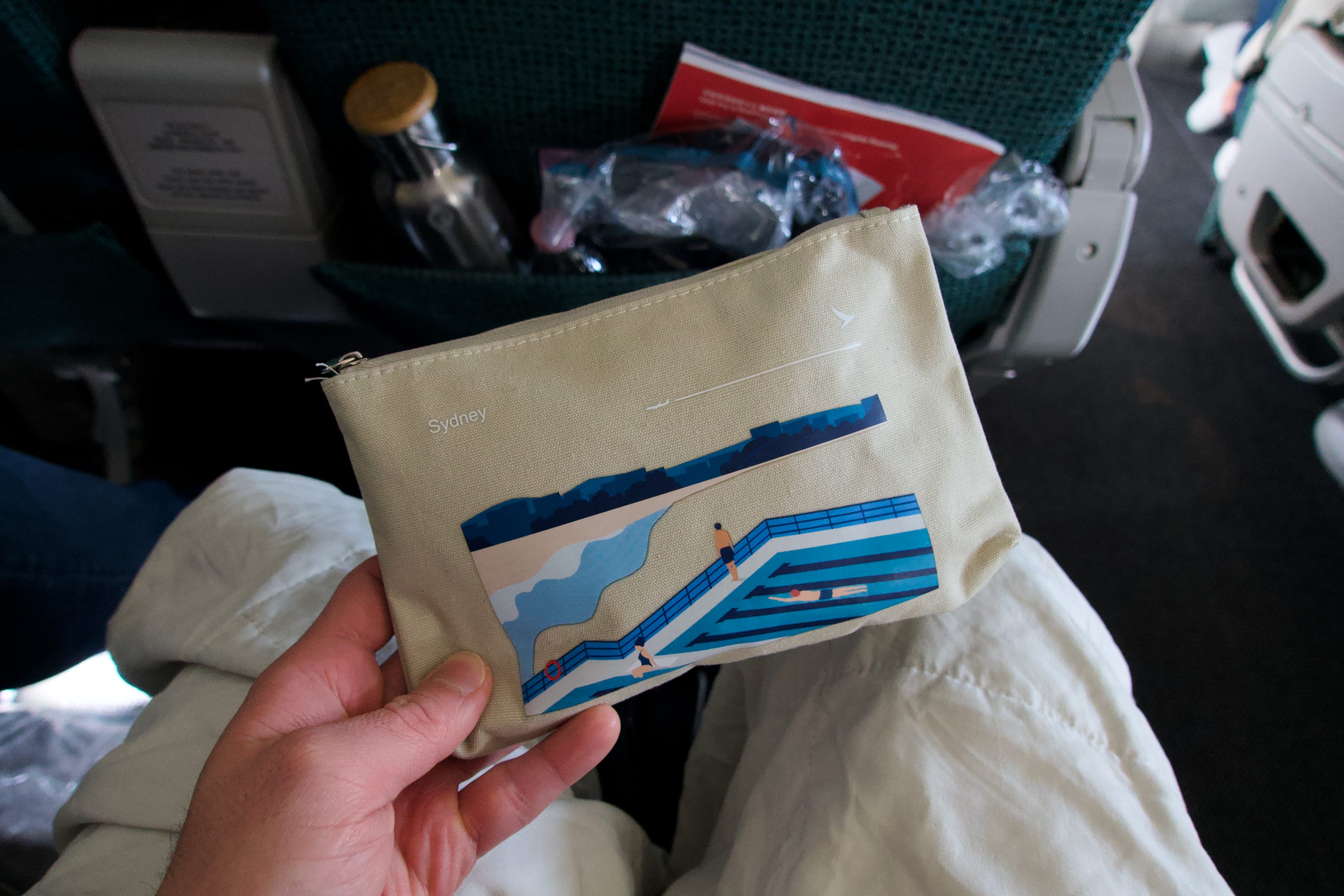 The canvas amenity kit with a beautiful illustration of Sydney's pools